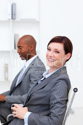 Portrait of two smiling multi-ethnic colleagues