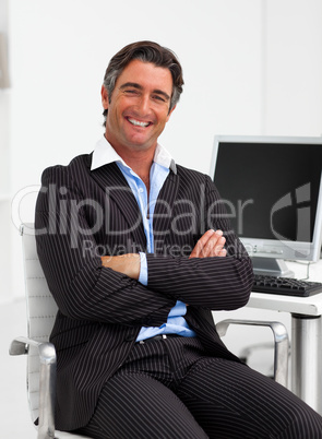 Attractive businessman with folded arms