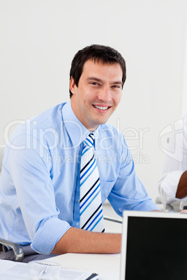 Portrait of a smiling businessman at work