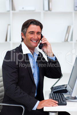Attractive businessman making a phone call