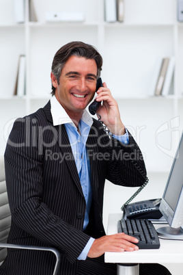 Confident businessman talking on phone