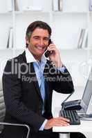 Confident businessman talking on phone