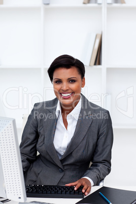 Beautiful female executive working at a computer