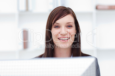 Close-up of a smiling businesswoman at work