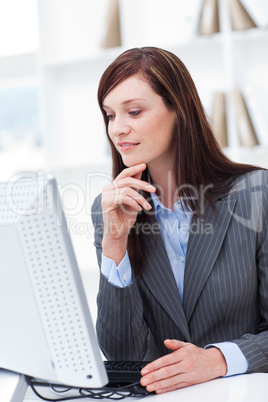 Close-up of a serious businesswoman working at a computer