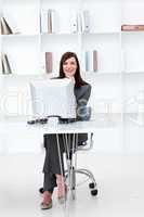 High angle of a smiling businesswoman working at a computer