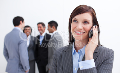 Portrait of smiling businesswoman on phone