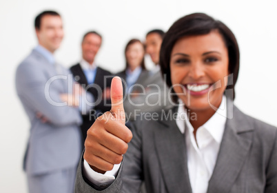 Portrait of an ethnic businesswoman with thumb up