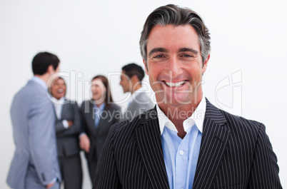 Smiling businessman leading her team