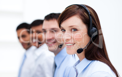 Business team with headset on working in a call center