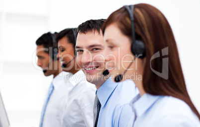 Multi-ethnic customer service agents in a call center