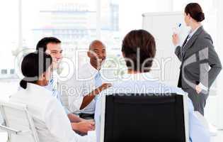 Businesswoman giving a presentation to her team