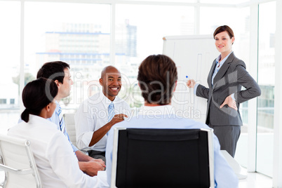 Confident businesswoman giving a presentation to her team