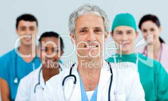 Senior doctor standing in front of his team