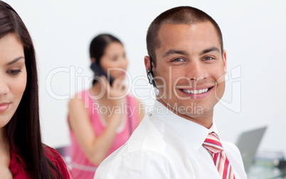 Smiling businessman with headset on