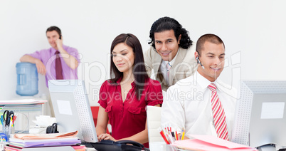 Businessman on phone by the watercooler