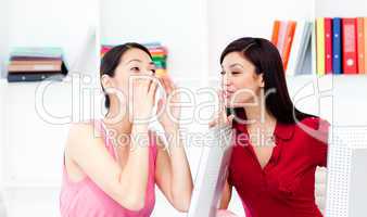 Businesswoman yelling and her colleague asking for silence