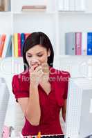 Portrait of an attractive businesswoman eating a red apple