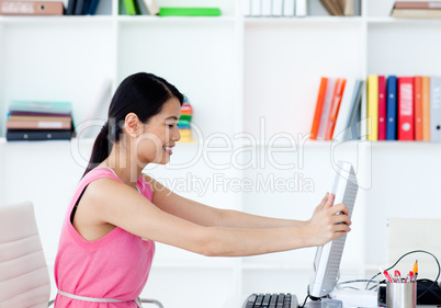 Attractive businesswoman getting frustrated with a computer