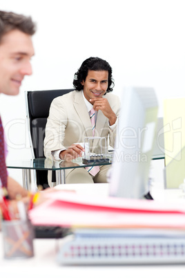Two smiling businessmen working in the office