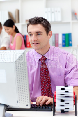 Confident businessman working at his computer