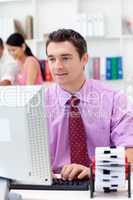 Confident businessman working at his computer