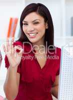 Young businesswoman giving the OK sign
