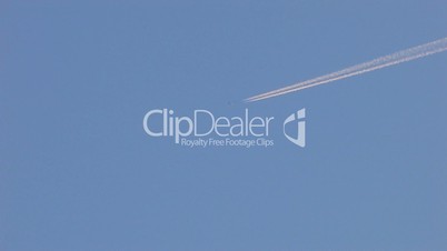 HD aircraft flying in clear sky and leaves trail