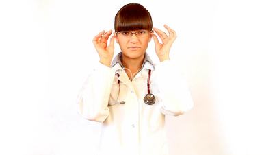 Young female doctor thinking