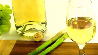 Zoomed Glass of white wine and asparagus Part one.