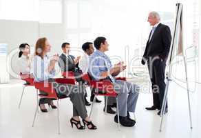 Senior businessman giving a conference