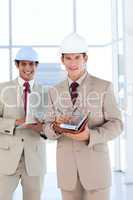 Portrait of two architects wearing hard hat