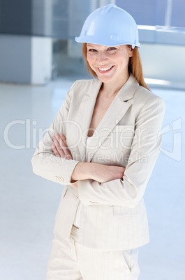 Attractive female architect wearing a hard hat