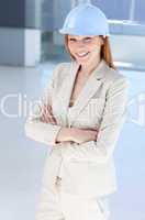 Attractive female architect wearing a hard hat