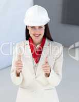 Close-up of a female architect with thumbs up