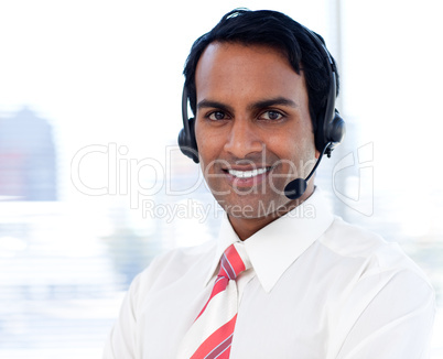 Portrait of a smiling businessman with headsets on