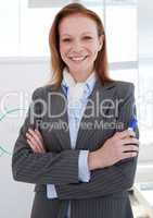 Attractive businesswoman in front of a white board