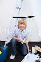 Portrait of little boy renovating home