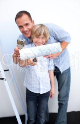 Portrait of a father and his boy renovating home