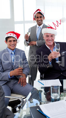 Confident businessmen wearing novelty Christmas hat