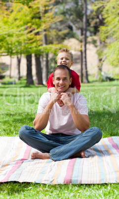 Cute little boy hugging his father