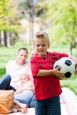 Little boy holding a soccer ball