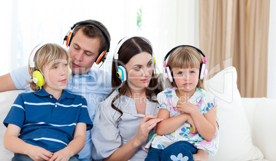 Young family listening music together