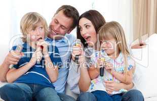 Happy parents and children having fun together