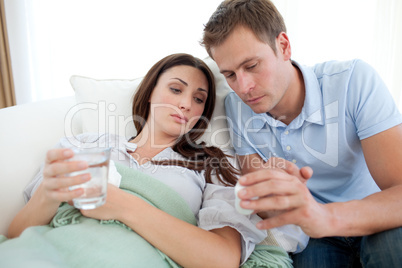 Carring man nursering his sick wife