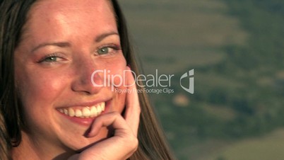HD young woman smiling on sunset