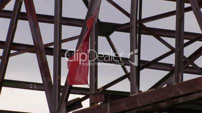 HD damaged red flag moving from wind