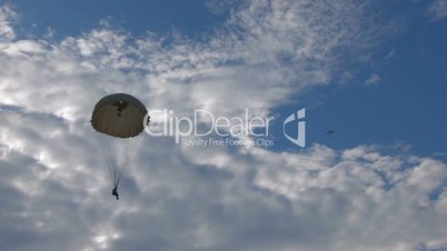 HD skydiving in blue sky with clouds