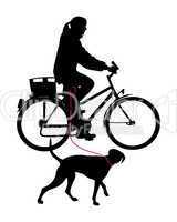 Radfahrerin mit Hund an der Leine