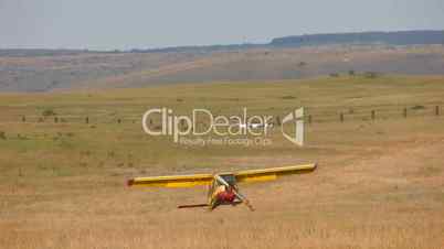 HD plane with propeller run in the middle of field